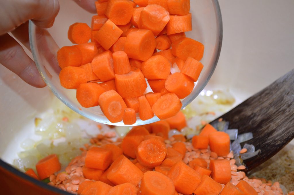 Adding carrots to lentil and onions for Coconut Curry Lentil Soup